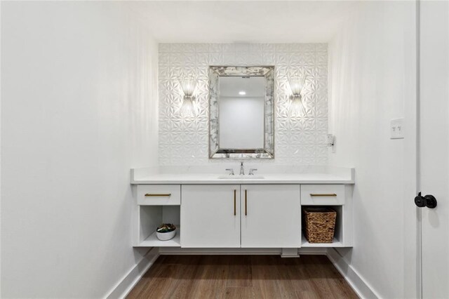 1201 N General Pershing St, Hammond, LA 70401 - bathroom featuring baseboards, vanity, and wood finished floors