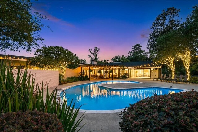 1201 N General Pershing St, Hammond, LA 70401 - view of swimming pool featuring a hot tub, fence, and a patio area