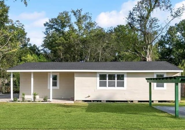 333 Killona Dr, Killona, LA 70057 - back of house with a carport and a lawn