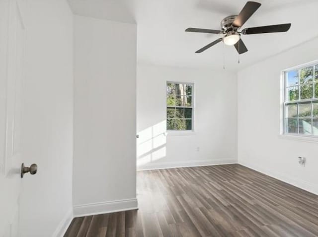 333 Killona Dr, Killona, LA 70057 - empty room featuring dark wood-type flooring, baseboards, and a ceiling fan