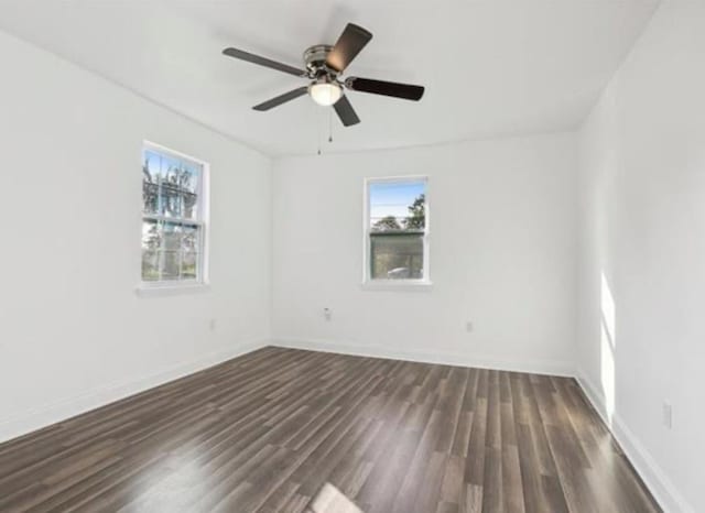 333 Killona Dr, Killona, LA 70057 - unfurnished room featuring plenty of natural light, dark wood finished floors, and baseboards