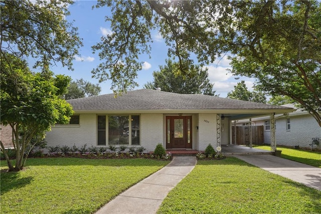 5835 Chamberlain Dr, New Orleans, LA 70122 - ranch-style house with concrete driveway, brick siding, and a carport
