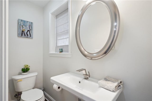 5835 Chamberlain Dr, New Orleans, LA 70122 - bathroom featuring toilet and a sink