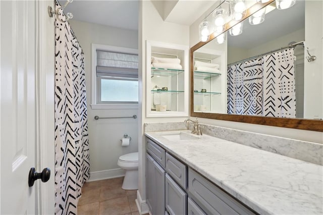 5835 Chamberlain Dr, New Orleans, LA 70122 - full bathroom with vanity, toilet, and tile patterned floors