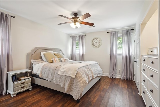 5835 Chamberlain Dr, New Orleans, LA 70122 - bedroom with dark wood finished floors, ceiling fan, and baseboards