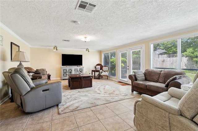 3851 Croydon St, Slidell, LA 70458 - living room with crown molding, light tile patterned floors, french doors, a textured ceiling, and baseboards