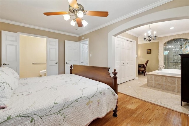 3851 Croydon St, Slidell, LA 70458 - bedroom with a chandelier, arched walkways, wood finished floors, crown molding, and a closet