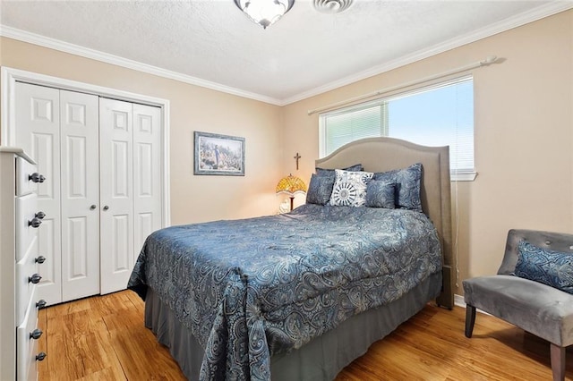 3851 Croydon St, Slidell, LA 70458 - bedroom with wood finished floors, a closet, and ornamental molding
