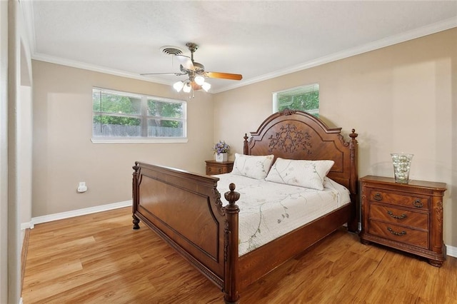 3851 Croydon St, Slidell, LA 70458 - bedroom featuring light wood-type flooring, crown molding, baseboards, and a ceiling fan
