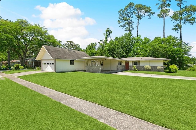 409 Markham Dr, Slidell, LA 70458 - single story home featuring concrete driveway, a front lawn, and a garage