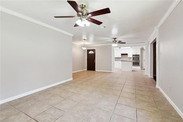 409 Markham Dr, Slidell, LA 70458 - unfurnished living room featuring a ceiling fan, ornamental molding, light tile patterned floors, and baseboards