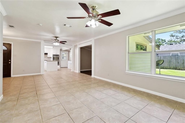 409 Markham Dr, Slidell, LA 70458 - unfurnished living room with a ceiling fan, baseboards, ornamental molding, and light tile patterned floors