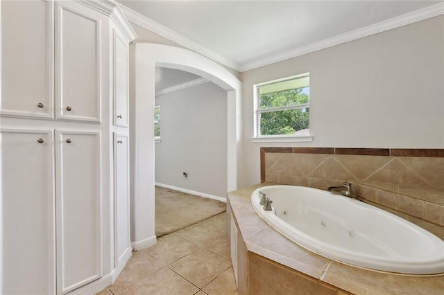 409 Markham Dr, Slidell, LA 70458 - bathroom with a whirlpool tub, ornamental molding, tile patterned floors, and baseboards