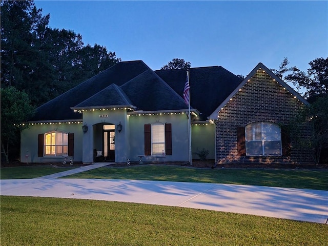 69359 6th Ave, Covington, LA 70433 - view of front of property with stucco siding and a front yard