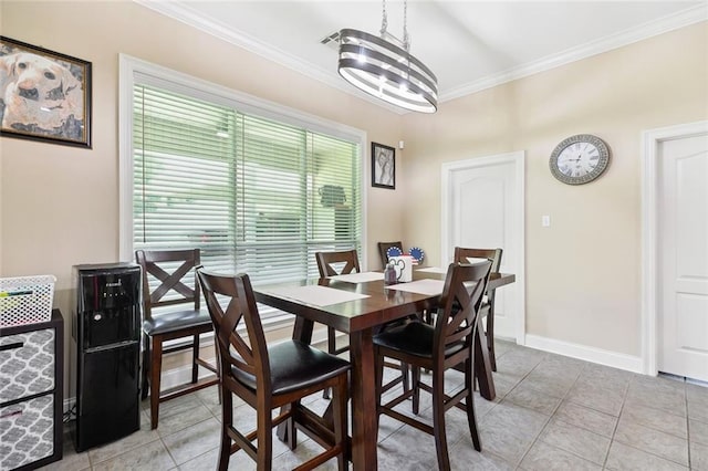 69359 6th Ave, Covington, LA 70433 - dining area featuring ornamental molding, light tile patterned floors, and baseboards