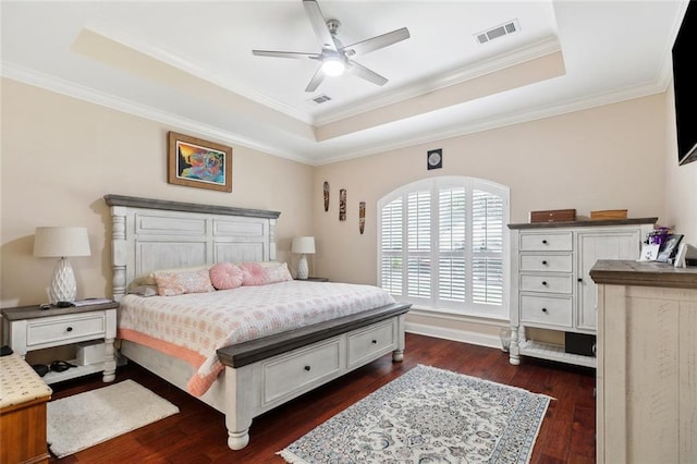 69359 6th Ave, Covington, LA 70433 - bedroom featuring a tray ceiling, dark wood-style flooring, crown molding, and ceiling fan