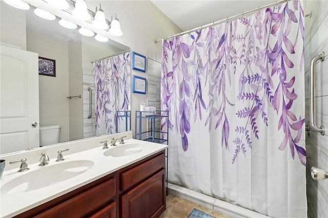 69359 6th Ave, Covington, LA 70433 - bathroom with tile patterned floors, double vanity, toilet, and curtained shower