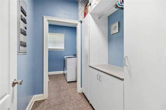 69359 6th Ave, Covington, LA 70433 - washroom featuring baseboards, washer and dryer, and light tile patterned flooring
