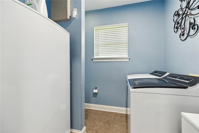 69359 6th Ave, Covington, LA 70433 - clothes washing area featuring independent washer and dryer, baseboards, and tile patterned flooring