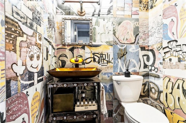 3000 Saint Charles Ave Unit 408, New Orleans, LA 70115 - half bathroom featuring toilet and a sink