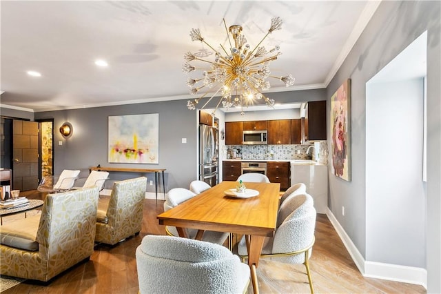 3000 Saint Charles Ave Unit 408, New Orleans, LA 70115 - dining space with baseboards, light wood-type flooring, a chandelier, ornamental molding, and recessed lighting