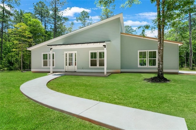82188 Charles Kelly Rd, Bush, LA 70431 - back of house with a lawn and a patio