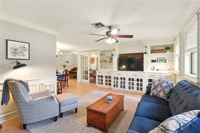 6200 Morton St, Metairie, LA 70003 - living area with crown molding, tile patterned flooring, ceiling fan, and a chandelier