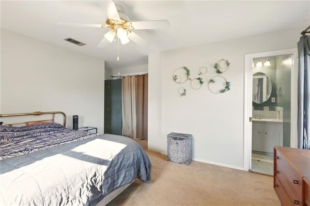 6200 Morton St, Metairie, LA 70003 - bedroom featuring light carpet, a sink, a ceiling fan, and ensuite bathroom