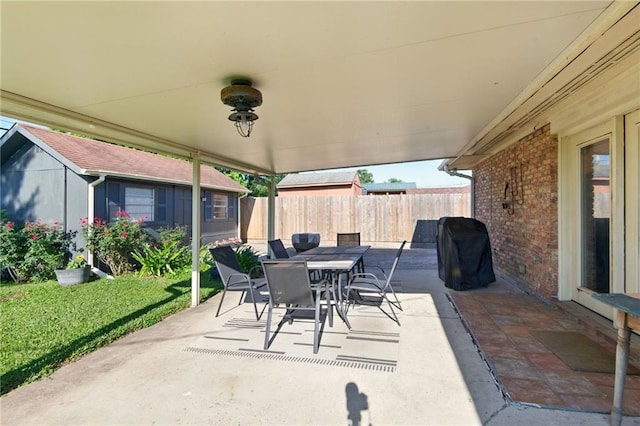 6200 Morton St, Metairie, LA 70003 - view of patio featuring fence, outdoor dining space, and area for grilling