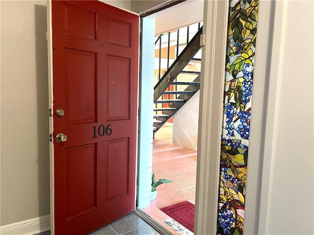 222 London Ave Unit 106, Metairie, LA 70005 - foyer entrance with stairway and baseboards