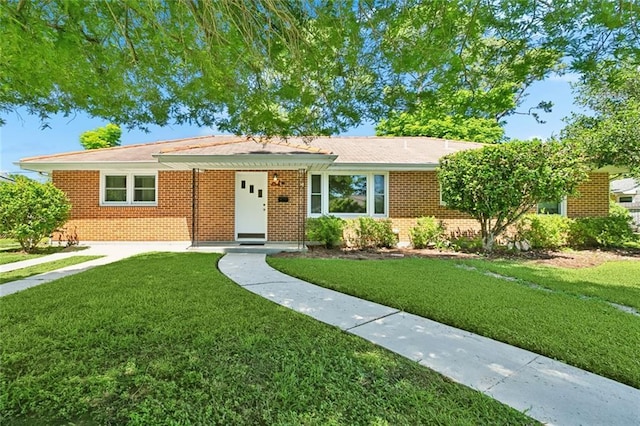 16 Ravan Ave, Harahan, LA 70123 - ranch-style house featuring a front lawn and brick siding