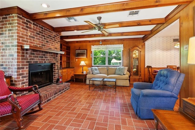 16 Ravan Ave, Harahan, LA 70123 - living area featuring brick patterned floors, wooden walls, ceiling fan, beam ceiling, and a fireplace