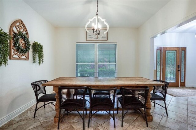 60 Bleu Lake Dr, Covington, LA 70435 - dining space with a chandelier, tile patterned flooring, and baseboards
