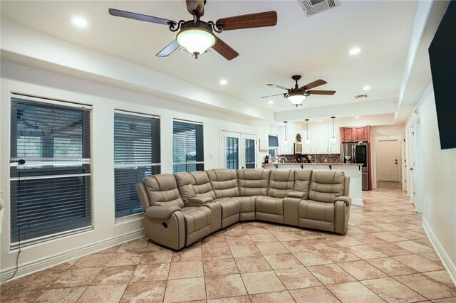 60 Bleu Lake Dr, Covington, LA 70435 - living room with a ceiling fan, baseboards, recessed lighting, plenty of natural light, and light tile patterned floors