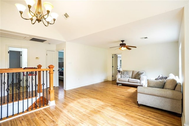 60 Bleu Lake Dr, Covington, LA 70435 - living area with attic access, light wood-style flooring, ceiling fan, baseboards, and a chandelier
