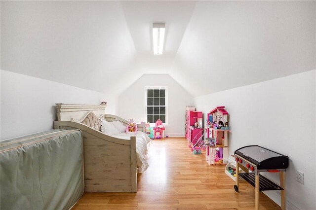 60 Bleu Lake Dr, Covington, LA 70435 - bedroom with vaulted ceiling and light wood finished floors