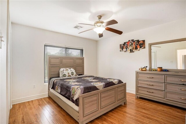 60 Bleu Lake Dr, Covington, LA 70435 - bedroom featuring light wood finished floors, baseboards, and a ceiling fan