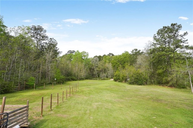 60 Bleu Lake Dr, Covington, LA 70435 - view of yard with a forest view