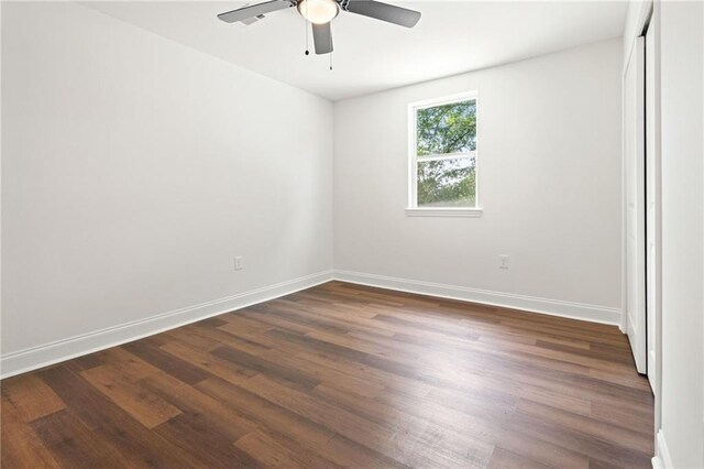 2122 N Butterfly Cir, Terrytown, LA 70056 - unfurnished room with a ceiling fan, dark wood-style floors, and baseboards
