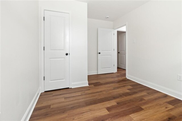 2122 N Butterfly Cir, Terrytown, LA 70056 - unfurnished bedroom with baseboards and wood finished floors