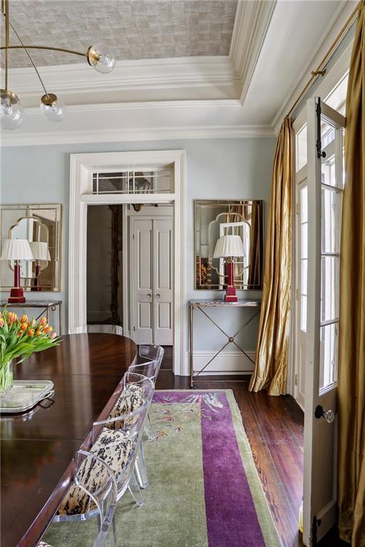 532-38 Governor Nicholls St, New Orleans, LA 70116 - foyer entrance featuring wood finished floors, a raised ceiling, and crown molding
