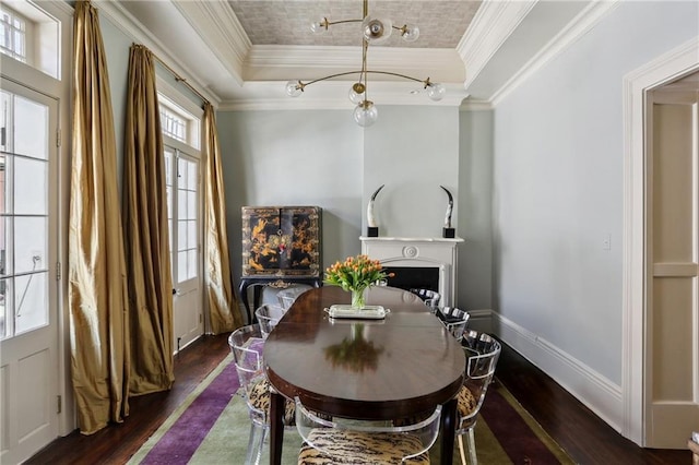 532-38 Governor Nicholls St, New Orleans, LA 70116 - dining space featuring ornamental molding, dark wood-style flooring, and a raised ceiling