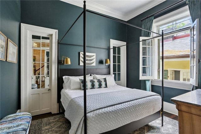 532-38 Governor Nicholls St, New Orleans, LA 70116 - bedroom with wood finished floors, crown molding, and baseboards