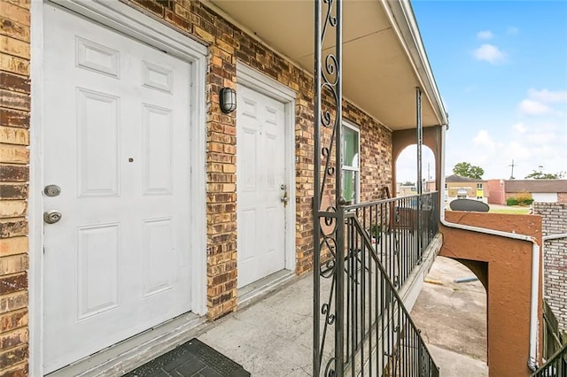 301618 Jean Lafitte Pkwy, Chalmette, LA 70043 - property entrance with covered porch and brick siding