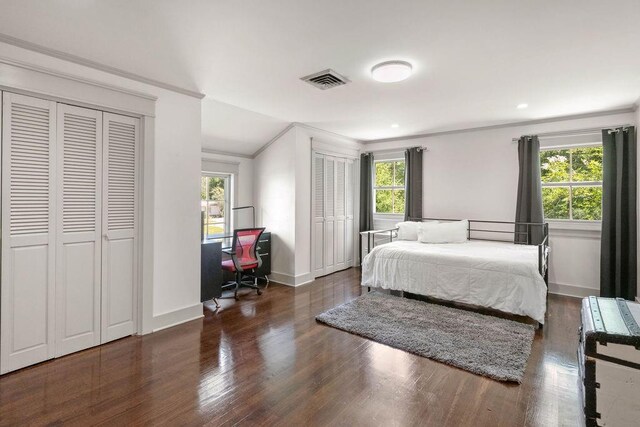 4 Riverdale Dr, Covington, LA 70433 - bedroom featuring ornamental molding, multiple closets, wood finished floors, and an office area