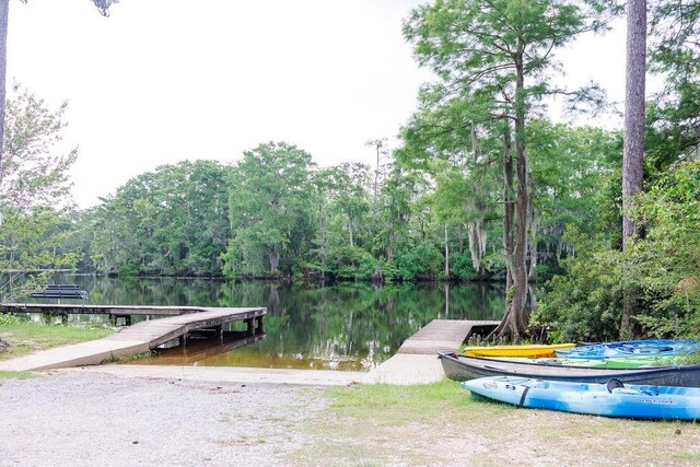 4 Riverdale Dr, Covington, LA 70433 - dock featuring a water view, a view of trees, and a boat ramp