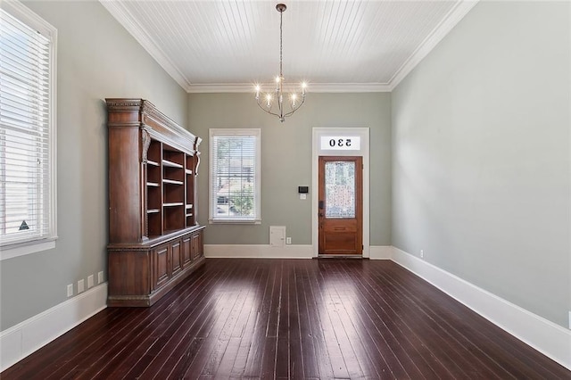 530 Spain St, New Orleans, LA 70117 - foyer entrance featuring a chandelier, dark wood finished floors, ornamental molding, and baseboards