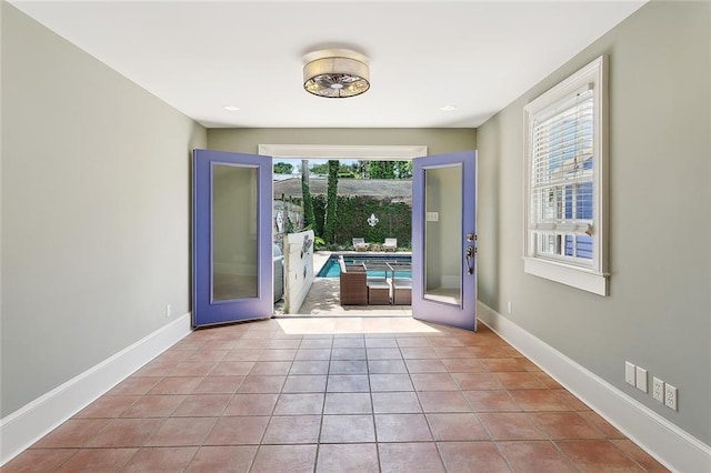 530 Spain St, New Orleans, LA 70117 - spare room featuring baseboards and tile patterned flooring
