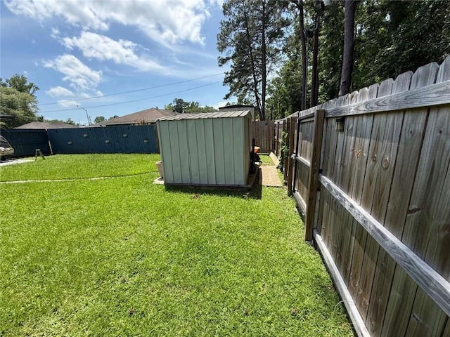 9425 Dancy Ave, Baton Rouge, LA 70814 - view of yard with a storage shed and an outbuilding
