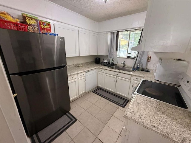 9425 Dancy Ave, Baton Rouge, LA 70814 - kitchen featuring white appliances, a sink, a textured ceiling, light countertops, and white cabinetry